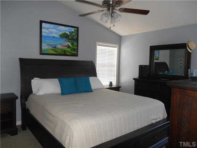 5012 Mocha Lane Raleigh, NC 27616 - Photo 9 of 14 a bedroom with a bed and a dresser