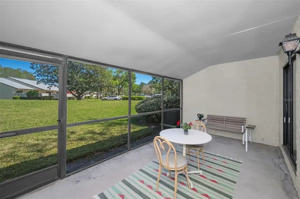 a view of a patio with a table chairs and a table