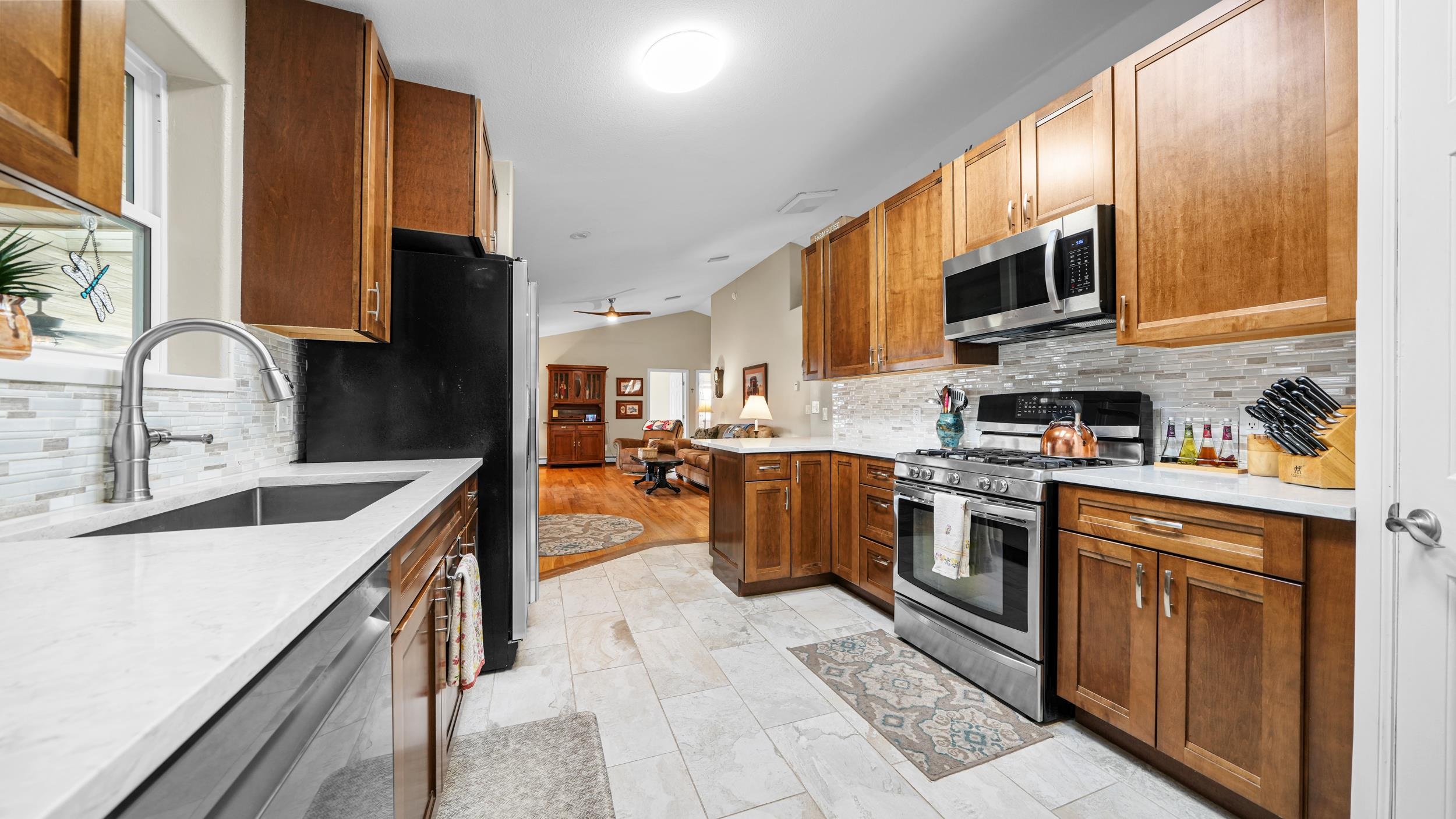 1392 M M 1/4 Road Loma, CO 81524 - Photo 13 of 42 a kitchen with stainless steel appliances granite countertop a sink and a stove