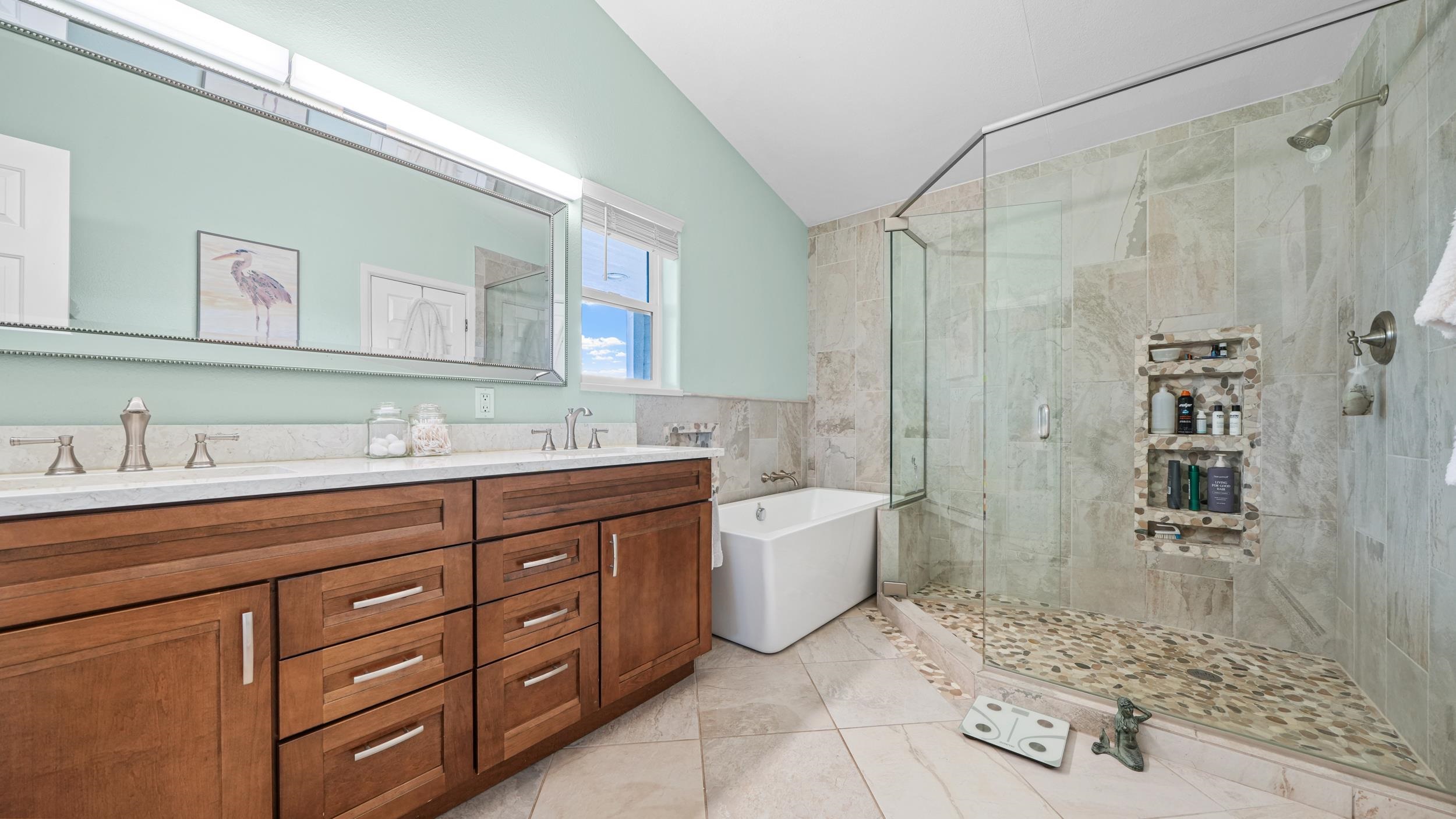 1392 M M 1/4 Road Loma, CO 81524 - Photo 18 of 42 a bathroom with a granite countertop sink a mirror a bathtub and shower