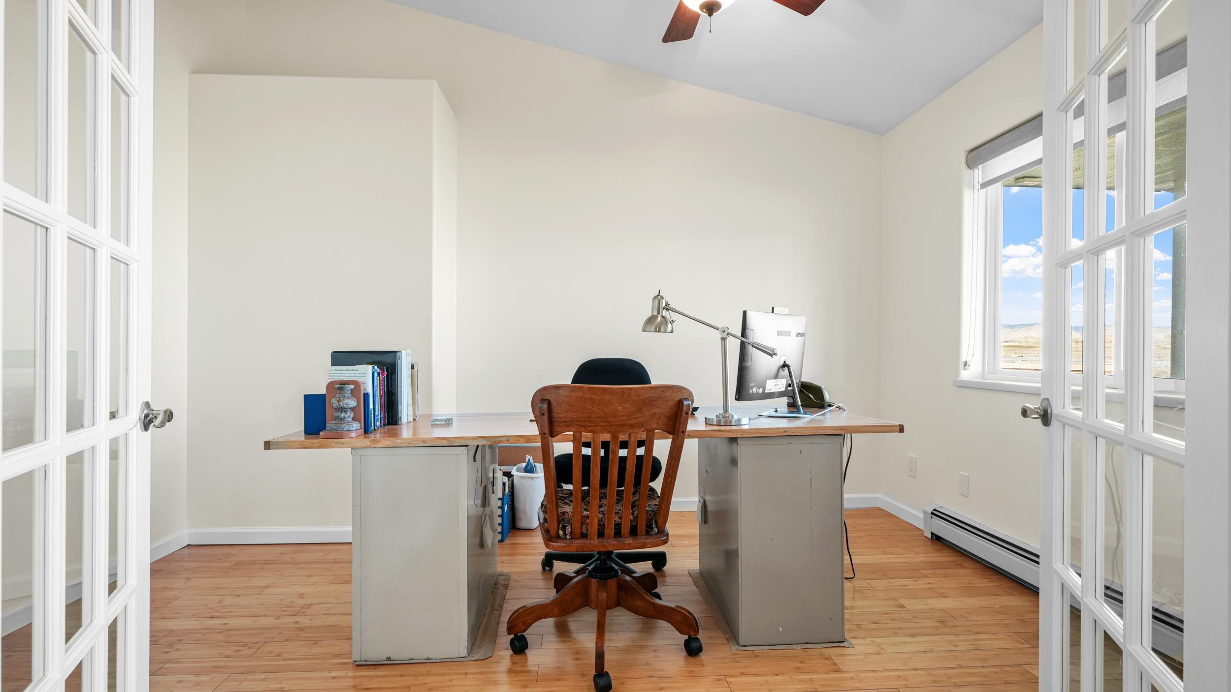1392 M M 1/4 Road Loma, CO 81524 - Photo 20 of 42 a view of a workspace with furniture and wooden floor