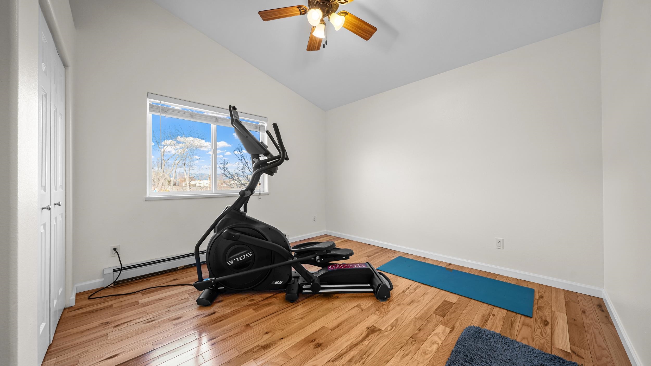 1392 M M 1/4 Road Loma, CO 81524 - Photo 21 of 42 a room with gym equipment and wooden floor