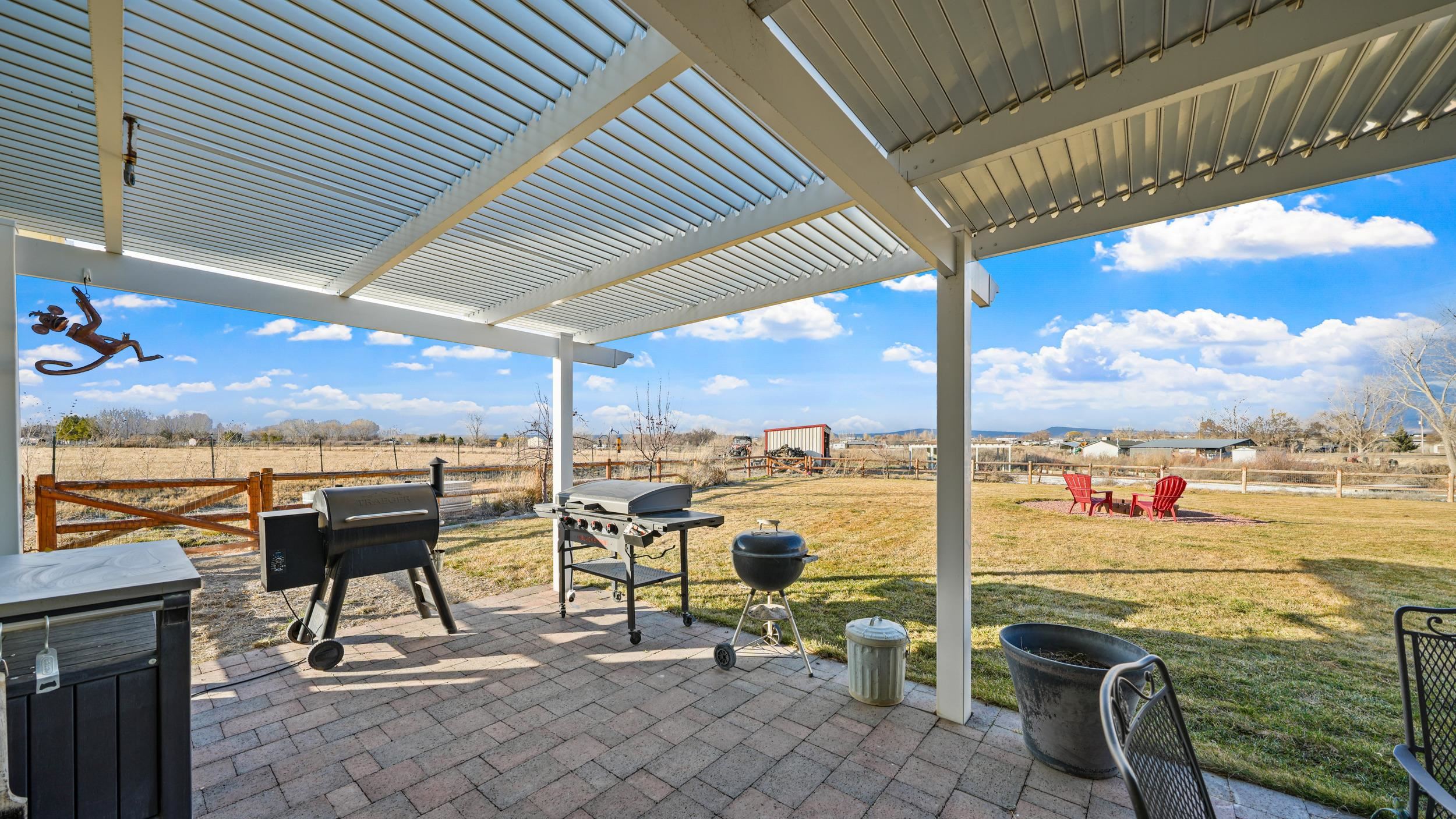 1392 M M 1/4 Road Loma, CO 81524 - Photo 24 of 42 a view of a terrace with furniture and garden