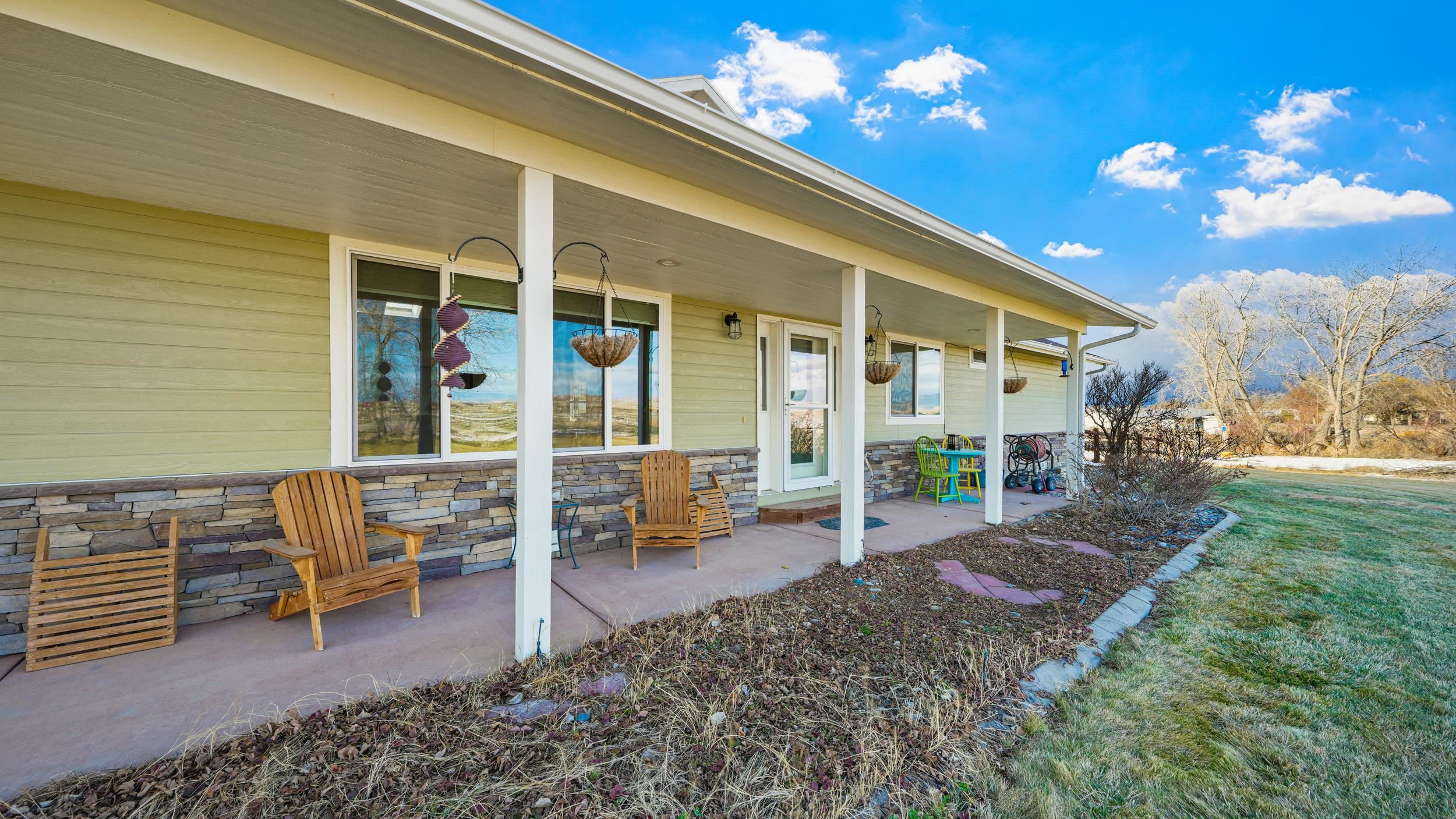1392 M M 1/4 Road Loma, CO 81524 - Photo 29 of 42 a view of a patio with chairs and tables