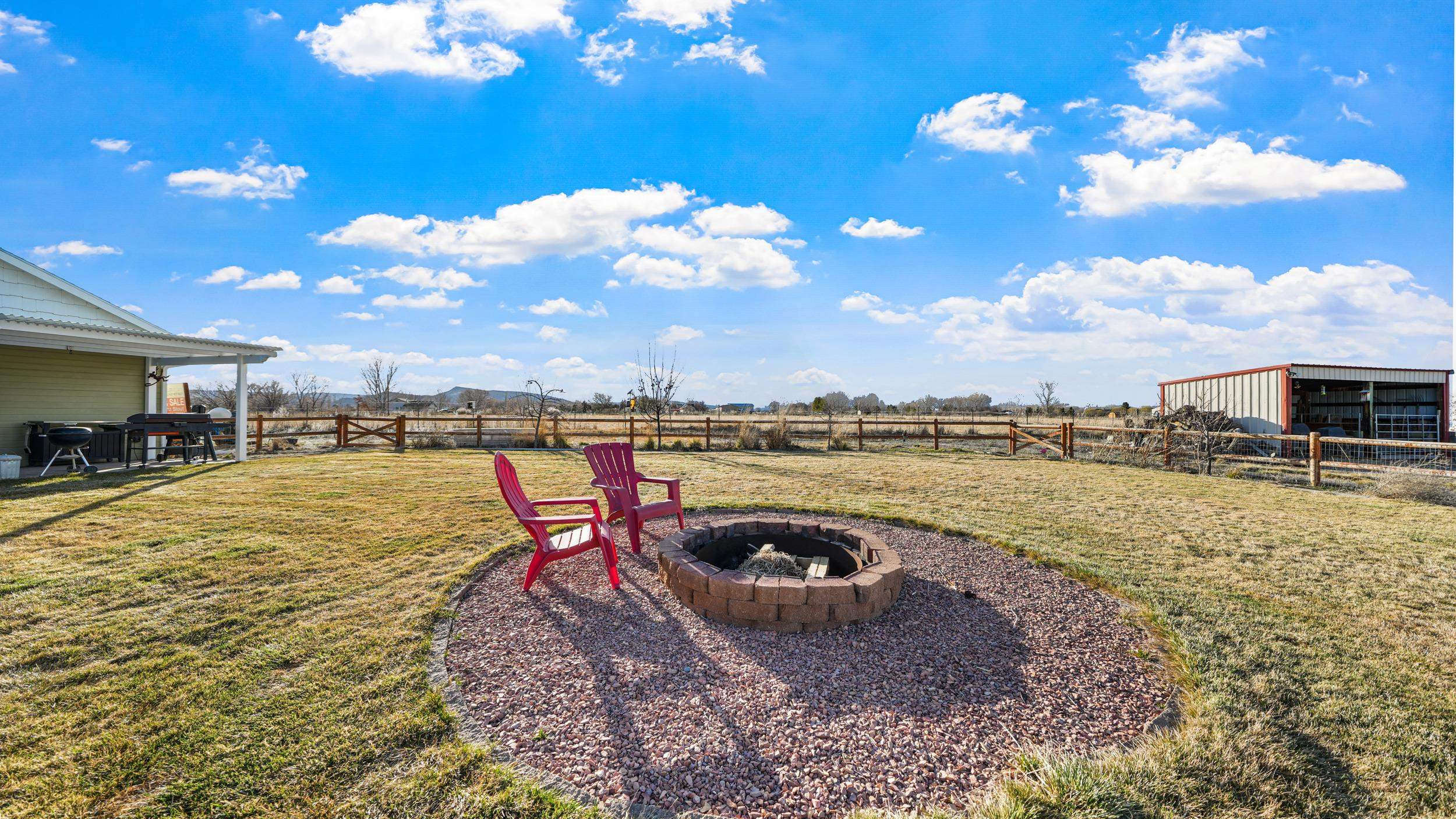 1392 M M 1/4 Road Loma, CO 81524 - Photo 32 of 42 a view of a swimming pool with a yard