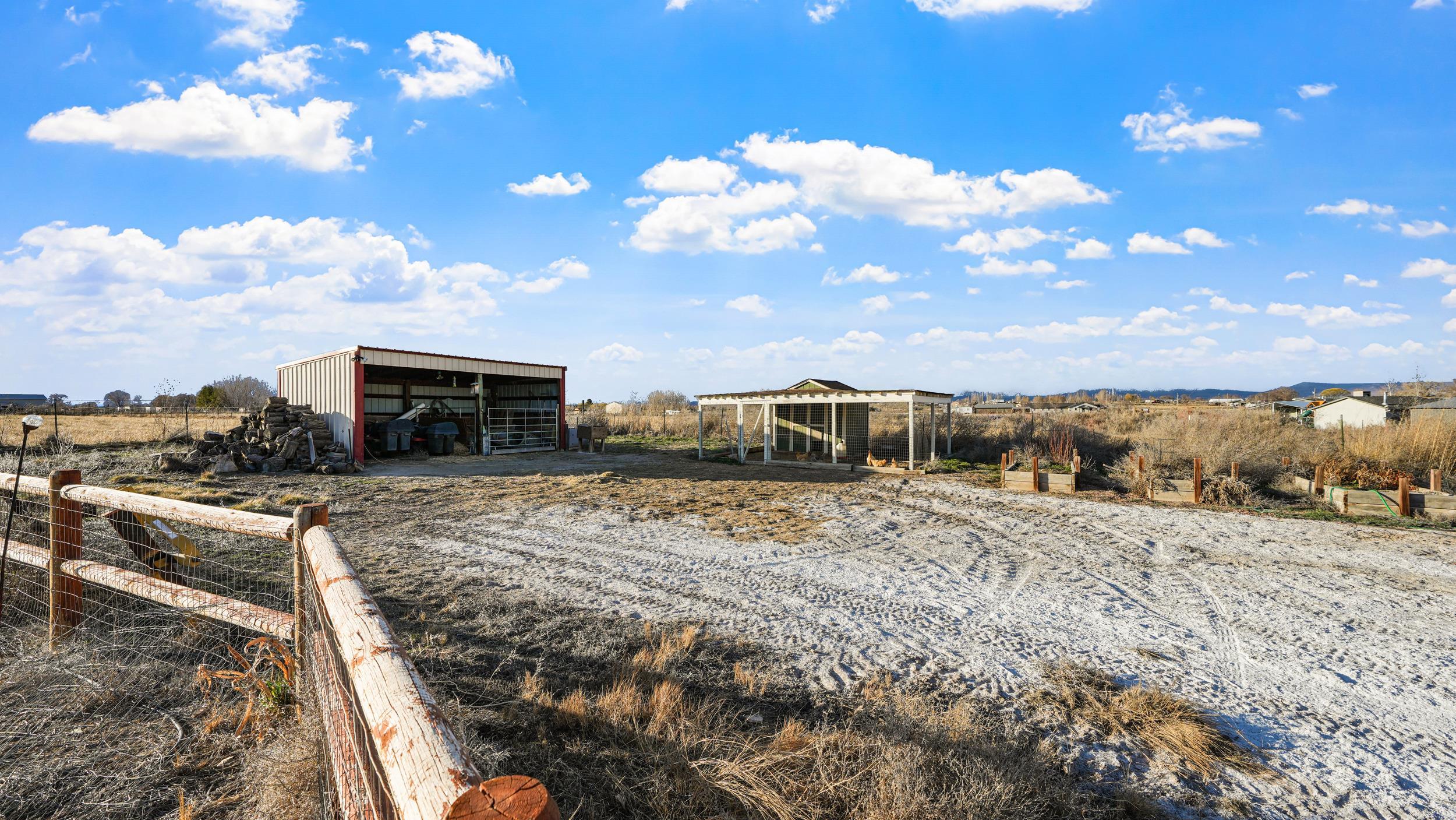 1392 M M 1/4 Road Loma, CO 81524 - Photo 33 of 42 a view of a dry yard with wooden fence