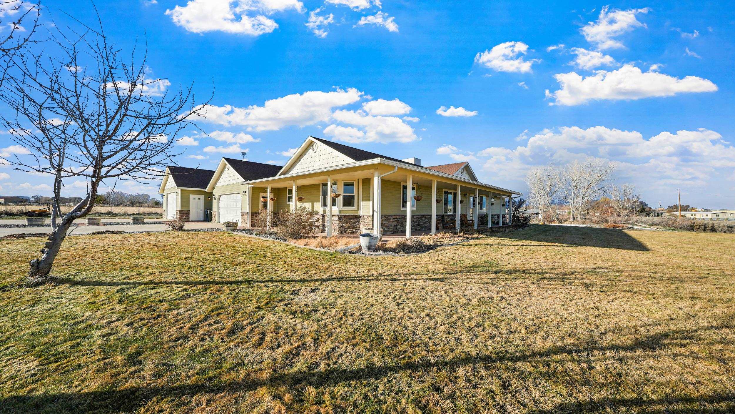 1392 M M 1/4 Road Loma, CO 81524 - Photo 34 of 42 a view of a house with a yard