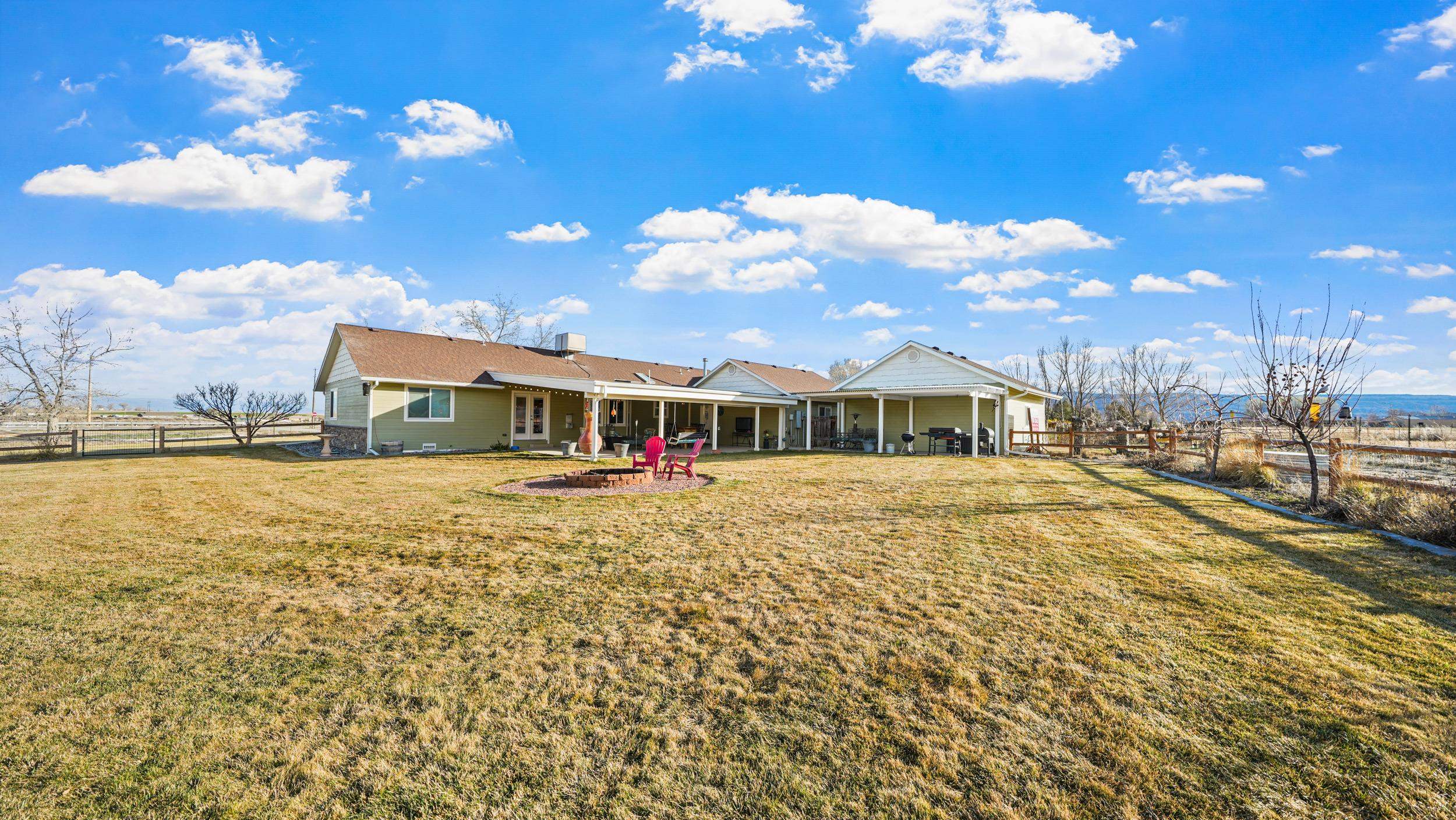 1392 M M 1/4 Road Loma, CO 81524 - Photo 36 of 42 a front view of a house with a yard