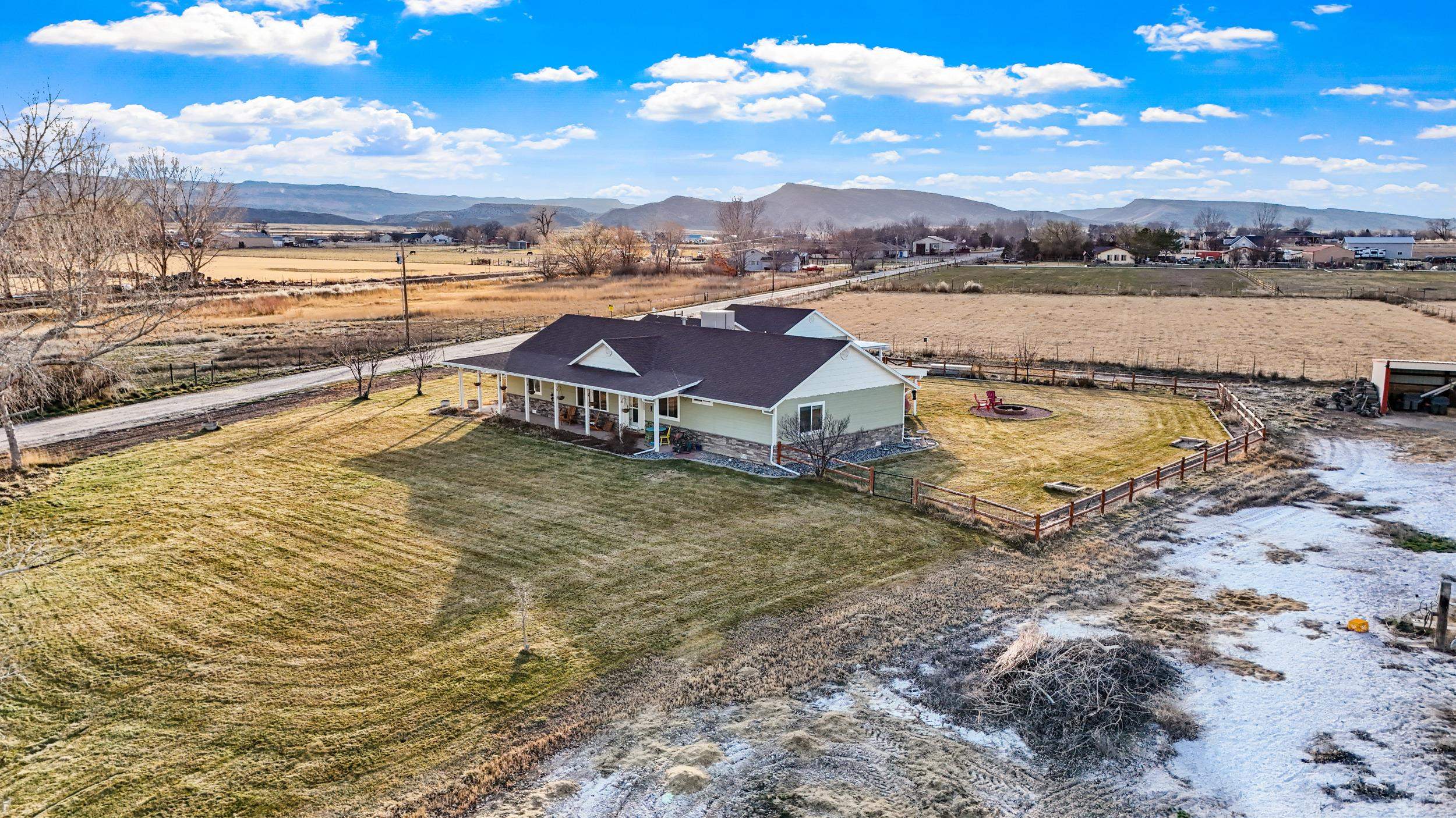 1392 M M 1/4 Road Loma, CO 81524 - Photo 37 of 42 a view of a lake with a mountain