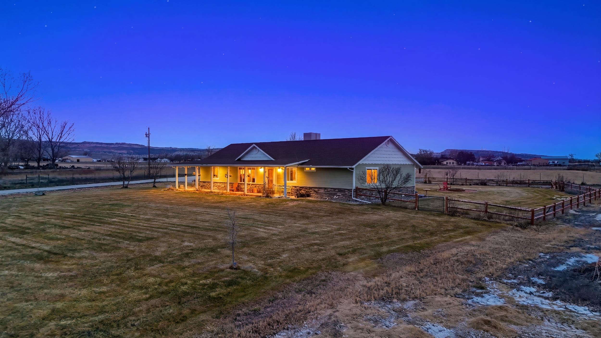 1392 M M 1/4 Road Loma, CO 81524 - Photo 38 of 42 a view of a house with a yard