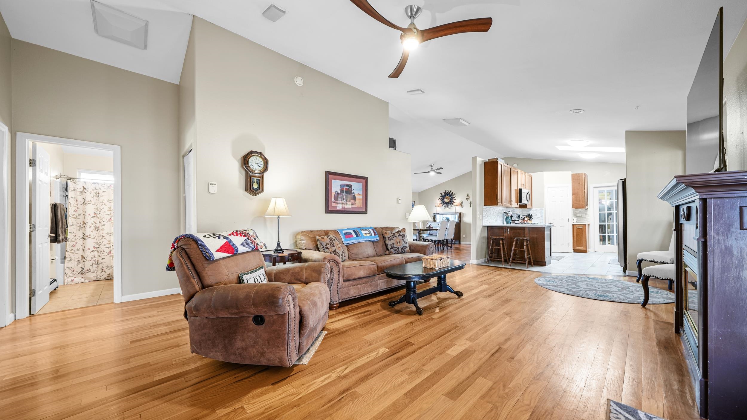 1392 M M 1/4 Road Loma, CO 81524 - Photo 8 of 42 a living room with fireplace furniture and a wooden floor