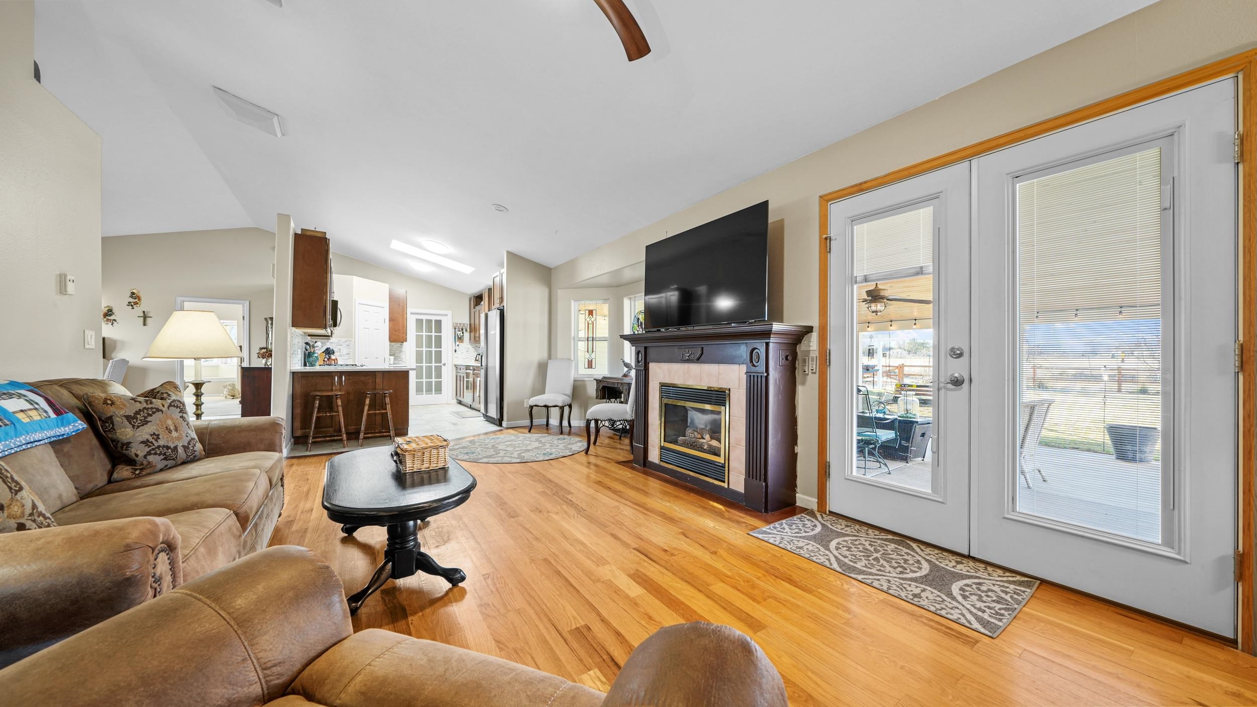 1392 M M 1/4 Road Loma, CO 81524 - Photo 9 of 42 a living room with furniture a fireplace and a flat screen tv