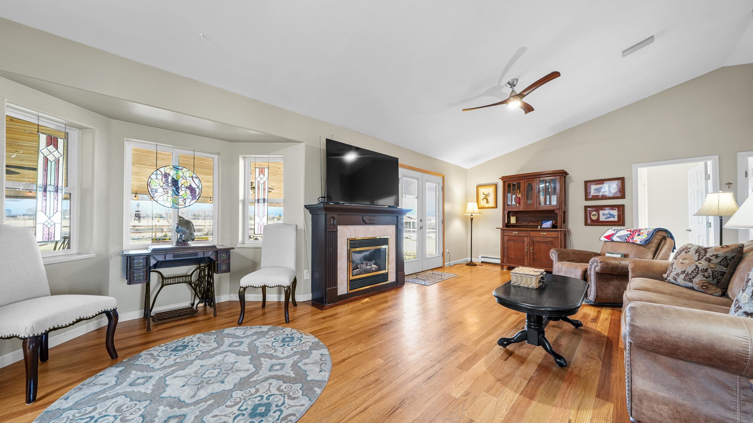 1392 M M 1/4 Road Loma, CO 81524 - Photo 10 of 42 a living room with fireplace furniture and a flat screen tv