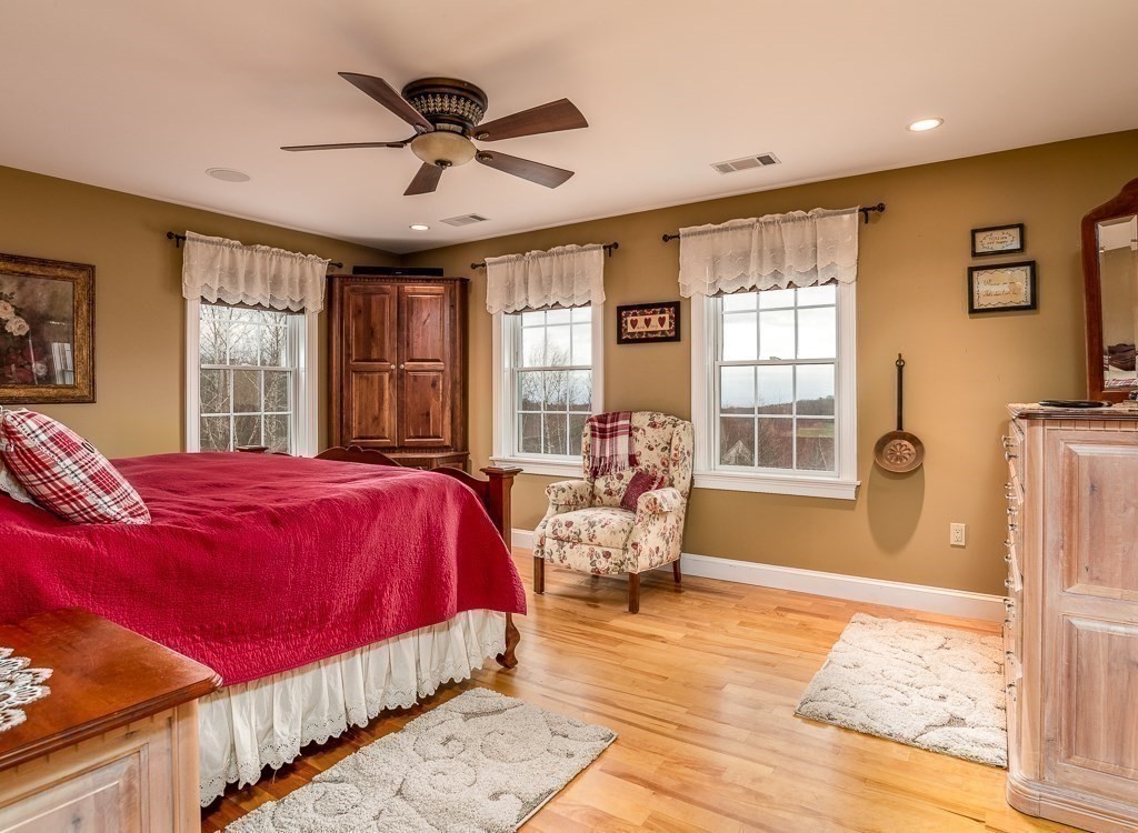 16 Ridge Road Hampden, MA 01036 - Photo 24 of 41 a spacious bedroom with a bed and glass windows