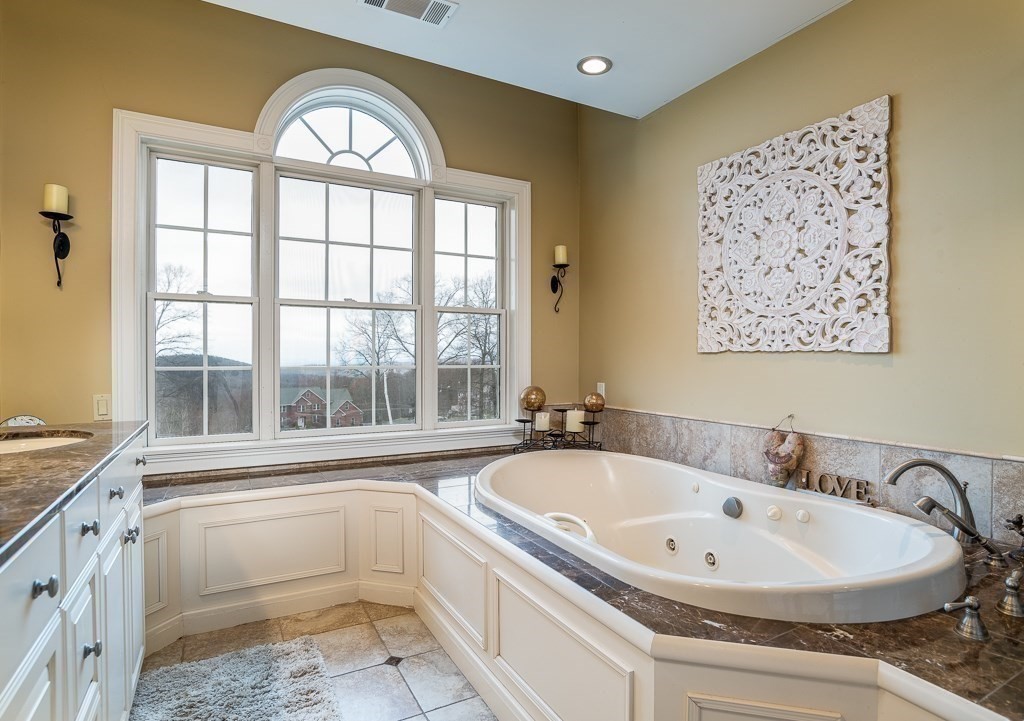 16 Ridge Road Hampden, MA 01036 - Photo 27 of 41 a bathroom with a bathtub and a window