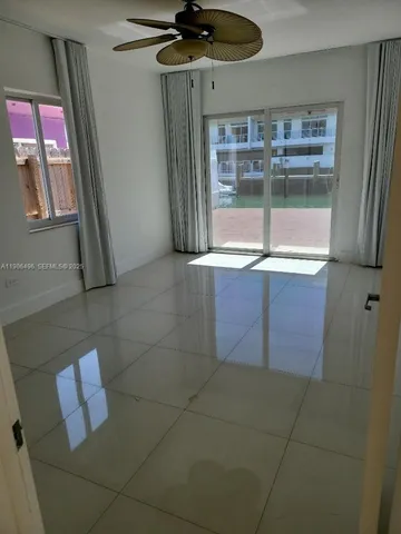 a kitchen with a sink a refrigerator and window