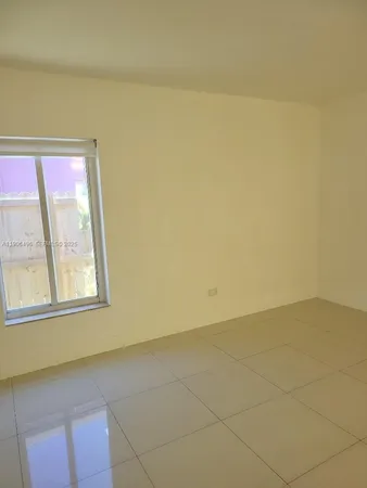 a kitchen with granite countertop a sink and a stove