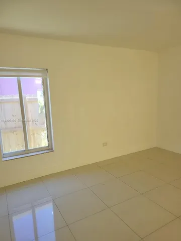a kitchen with granite countertop a sink and a stove
