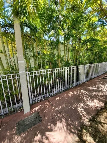 a kitchen with granite countertop a sink and cabinets