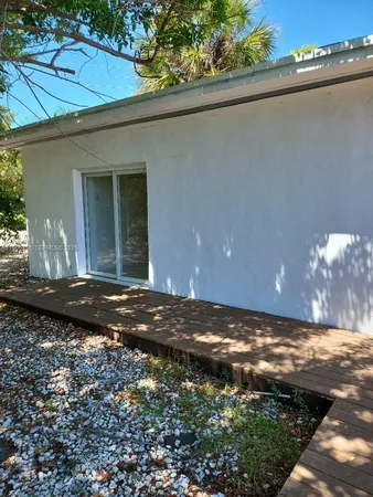 a bathroom with a window and a shower