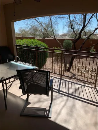 a view of sitting area with furniture in backyard