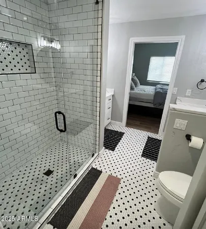 a bathroom with a toilet and a sink