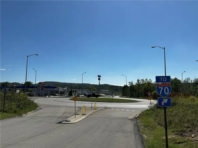 a view of a swimming pool with a yard