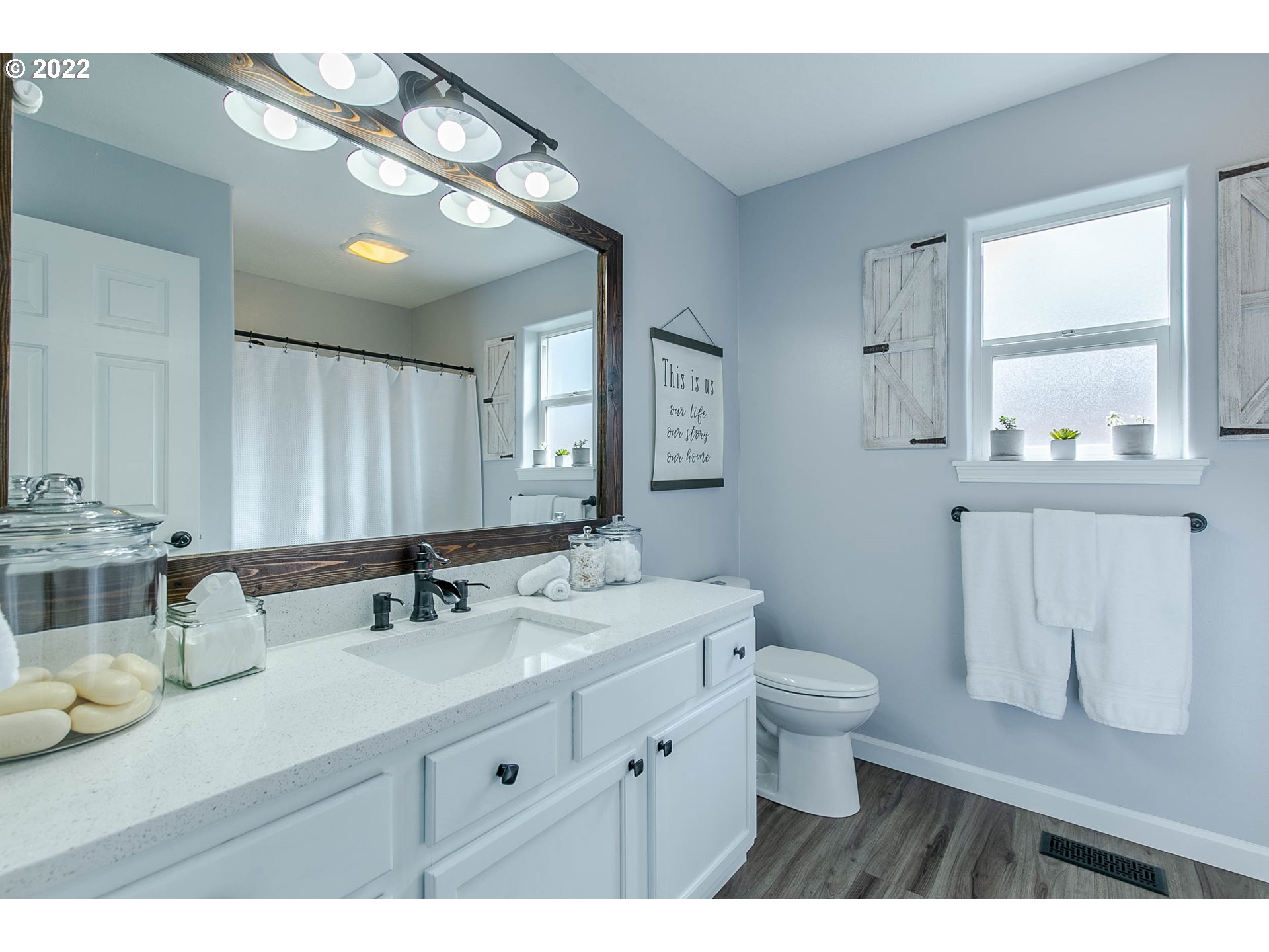 126 South 72nd Street Springfield, OR 97478 - Photo 16 of 32 a bathroom with a sink a toilet and a mirror