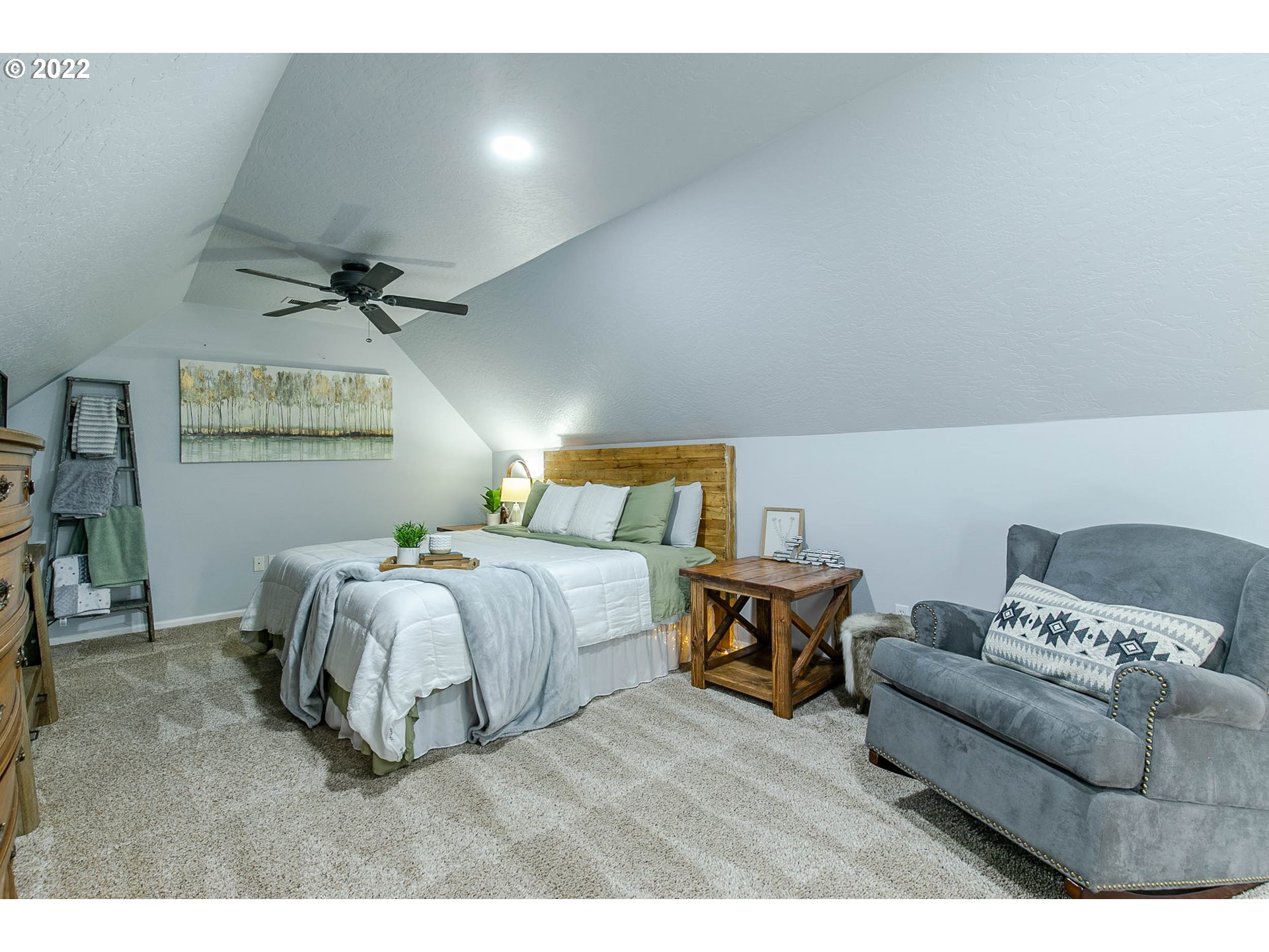 126 South 72nd Street Springfield, OR 97478 - Photo 20 of 32 a spacious bedroom with a bed and a flat screen tv