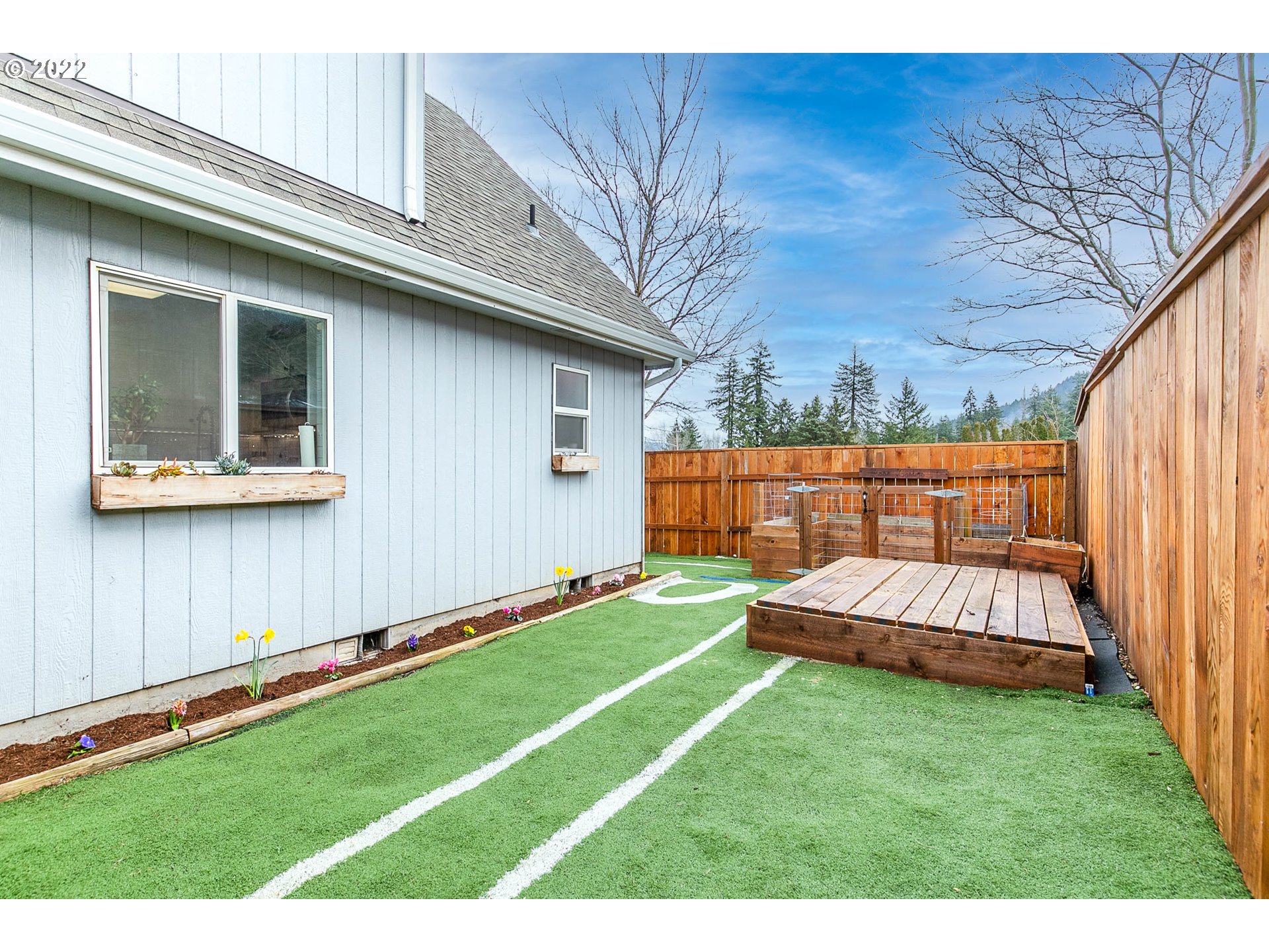 126 South 72nd Street Springfield, OR 97478 - Photo 30 of 32 a view of a backyard with a garden and deck