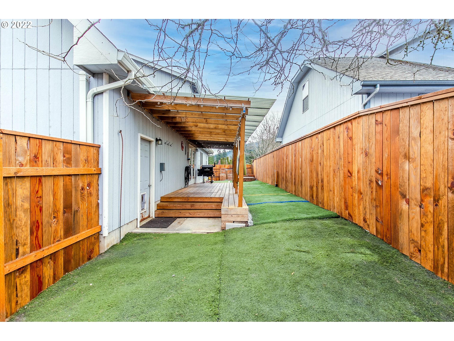 126 South 72nd Street Springfield, OR 97478 - Photo 31 of 32 a view of a backyard with wooden fence