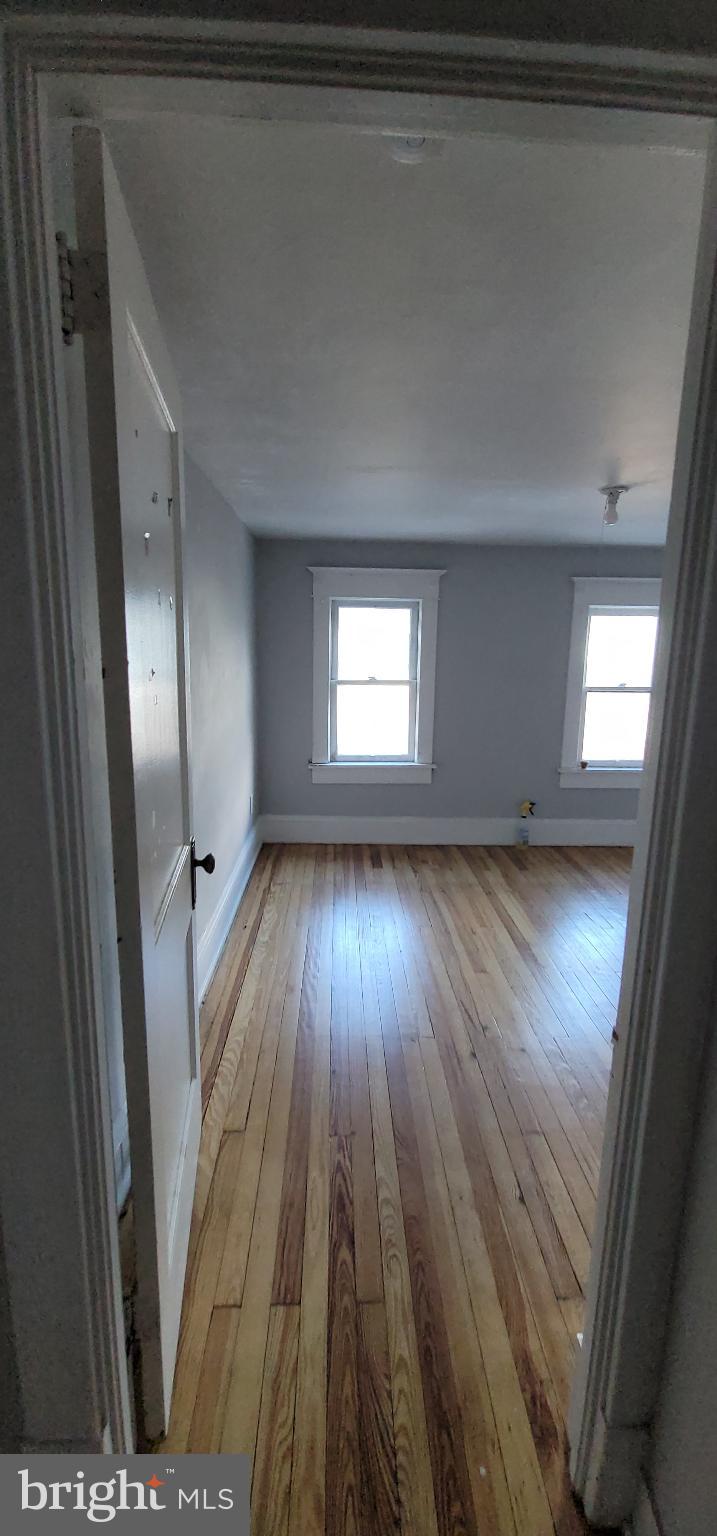 262 Indiana Avenue Shenandoah, PA 17976 - Photo 33 of 35 a view of wooden floor and windows in a room