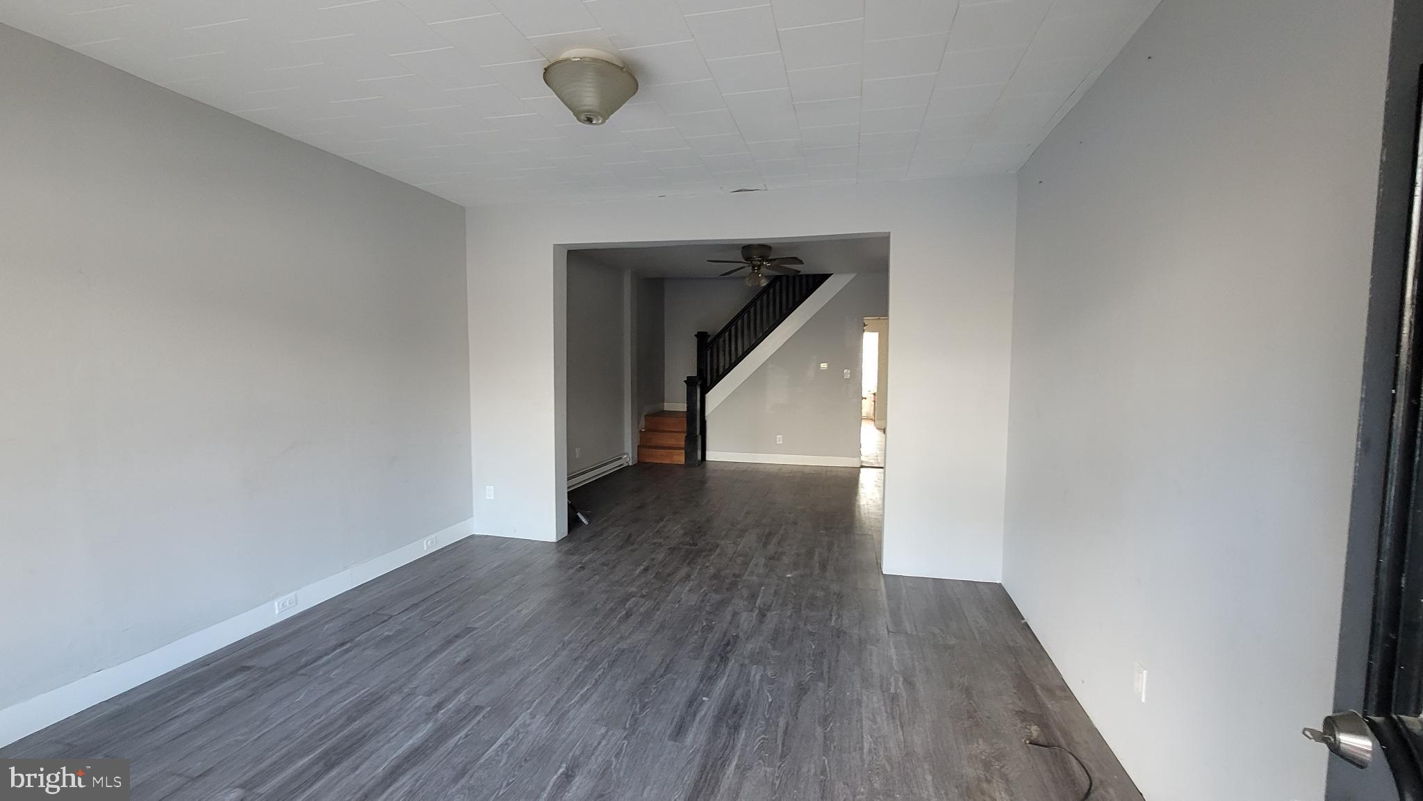 262 Indiana Avenue Shenandoah, PA 17976 - Photo 4 of 35 a view of a hallway with wooden floor