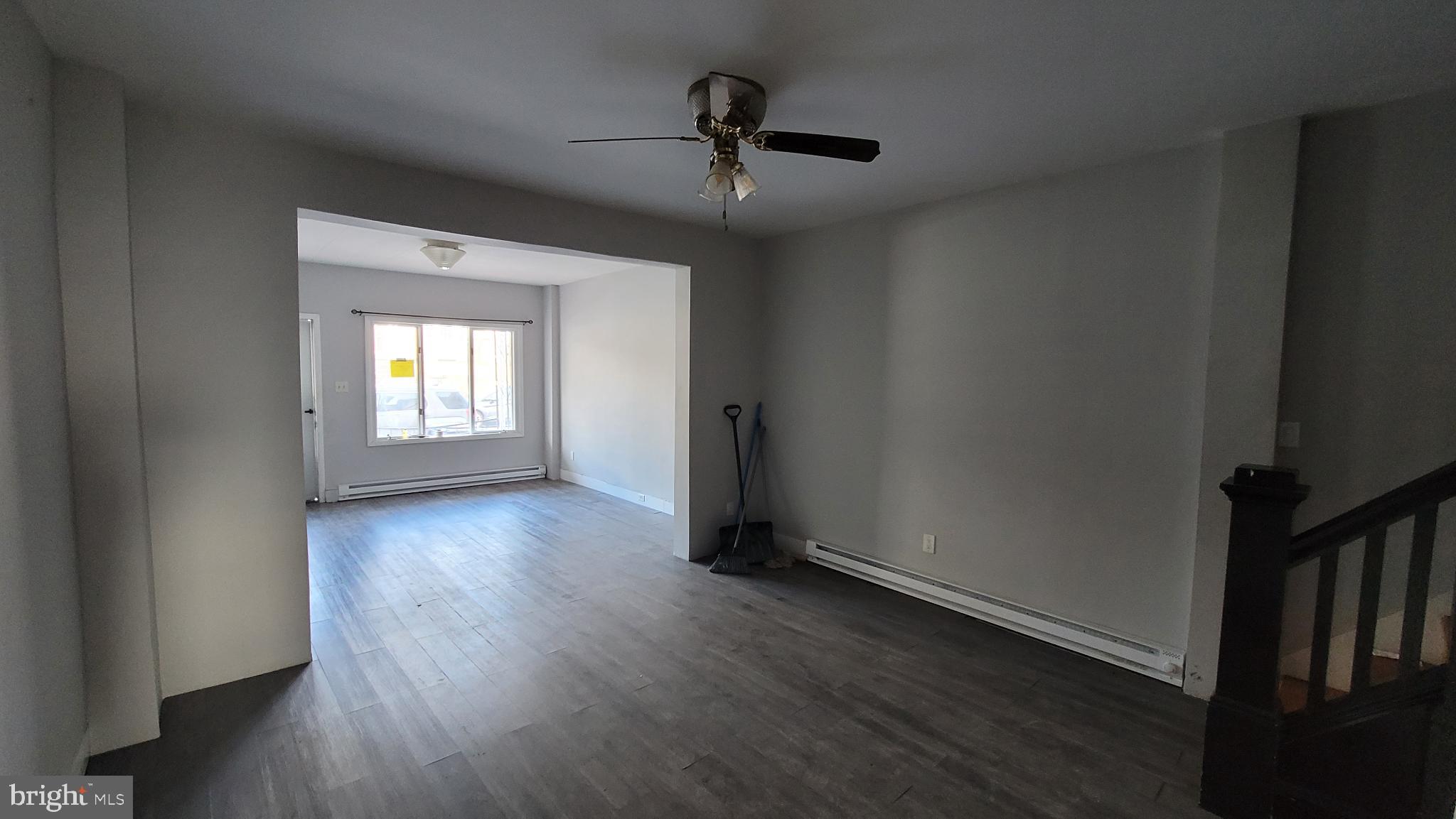 262 Indiana Avenue Shenandoah, PA 17976 - Photo 6 of 35 wooden floor in an empty room with a window