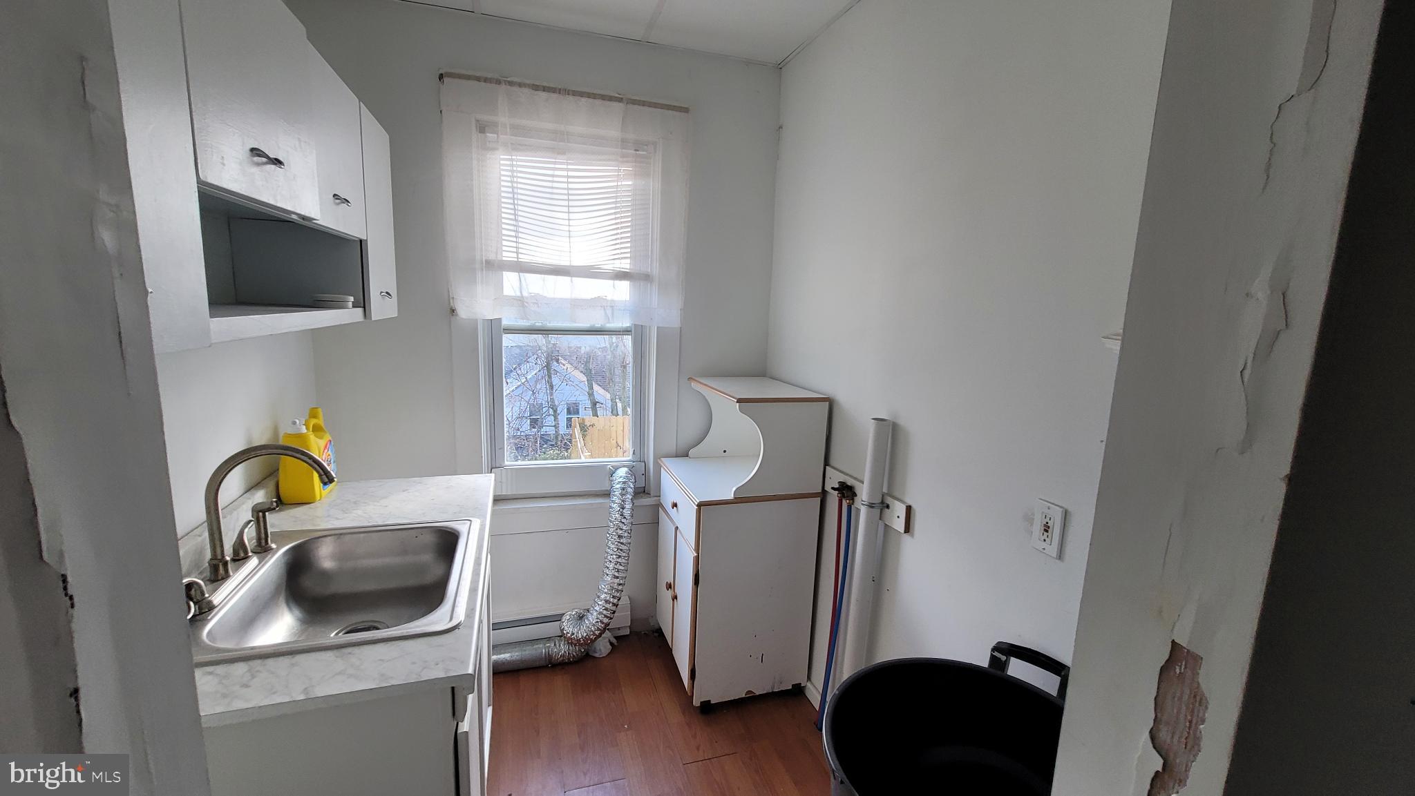 262 Indiana Avenue Shenandoah, PA 17976 - Photo 10 of 35 a bathroom with a sink and a window
