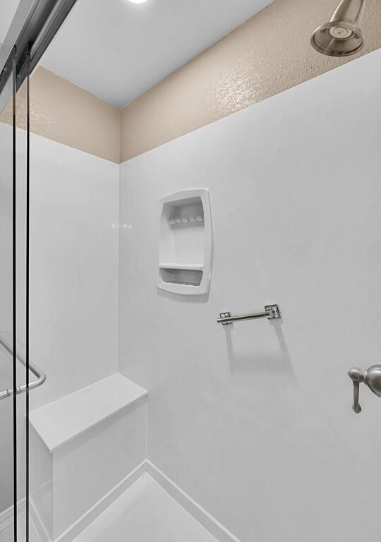 2857 Country Spring Road Lorena, TX 76655 - Photo 17 of 40 Full bathroom featuring a shower stall and baseboards