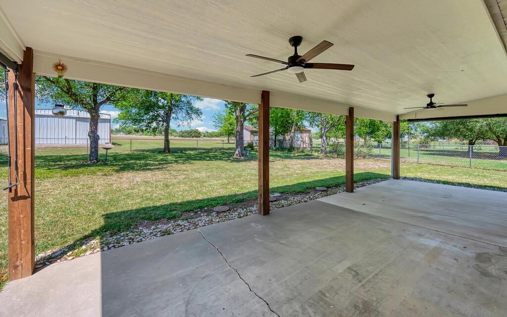 2857 Country Spring Road Lorena, TX 76655 - Photo 23 of 40 Fenced backyard featuring a patio and a ceiling fan