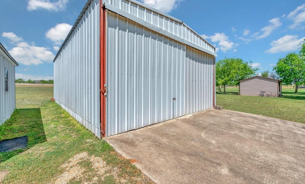 2857 Country Spring Road Lorena, TX 76655 - Photo 26 of 40 View of pole building featuring a lawn