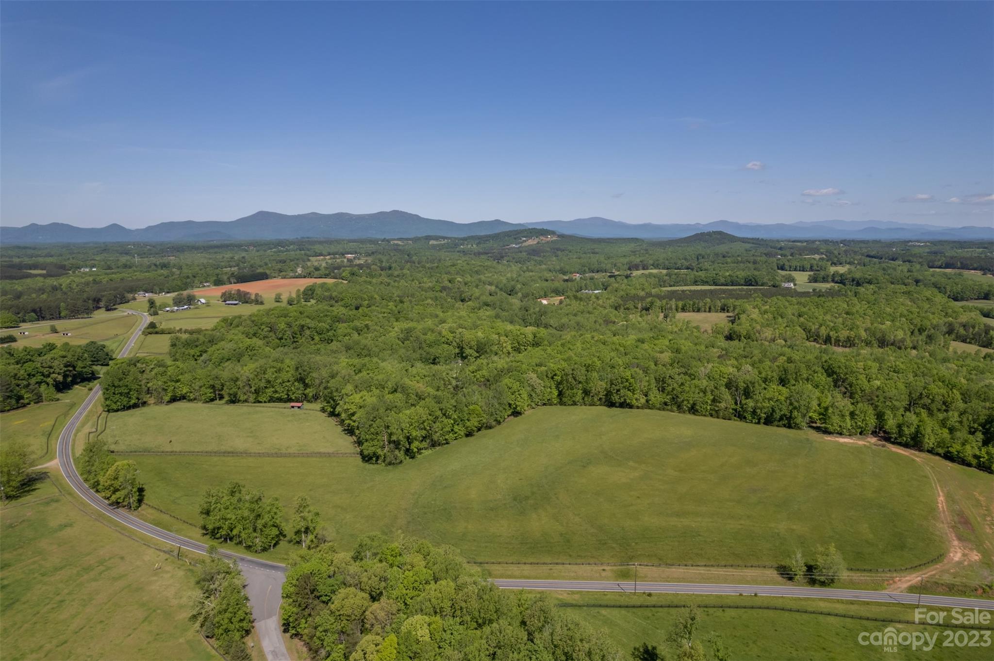0 Collinsville Road Columbus, NC 28722 - Photo 29 of 48 a view of a swimming pool and mountains in the background