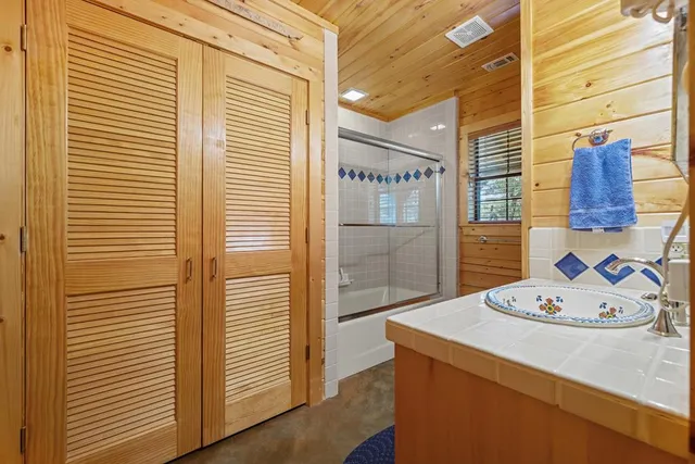 a bathroom with a sink and a shower