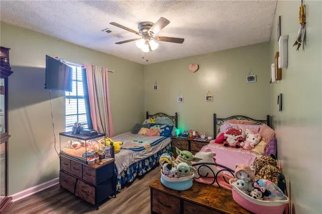 a bedroom with furniture and a window