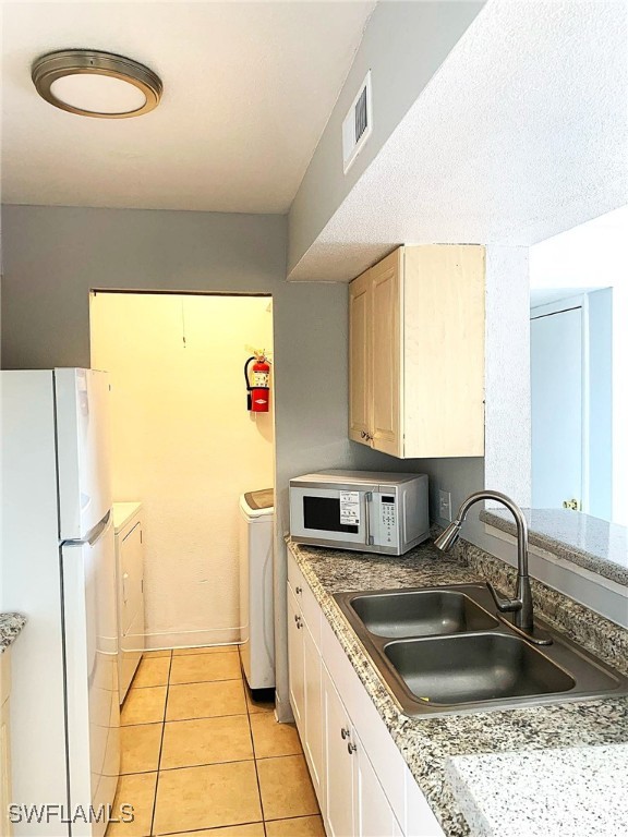 2929 Winkler Avenue, Unit 1018 Fort Myers, FL 33916 - Photo 15 of 34 a kitchen with stainless steel appliances granite countertop a sink stove and refrigerator