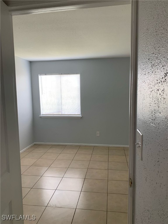 2929 Winkler Avenue, Unit 1018 Fort Myers, FL 33916 - Photo 20 of 34 a view of an empty room with a window