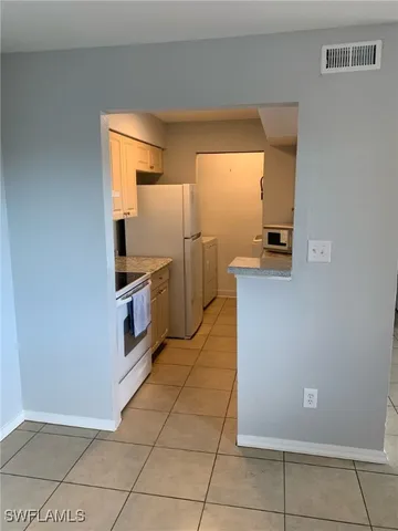 a bathroom with a sink vanity and mirror