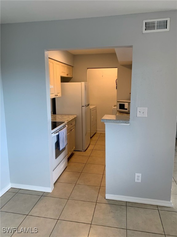 2929 Winkler Avenue, Unit 1018 Fort Myers, FL 33916 - Photo 22 of 34 a kitchen with stainless steel appliances a refrigerator and a stove