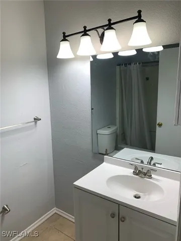 a bathroom with a sink and mirror