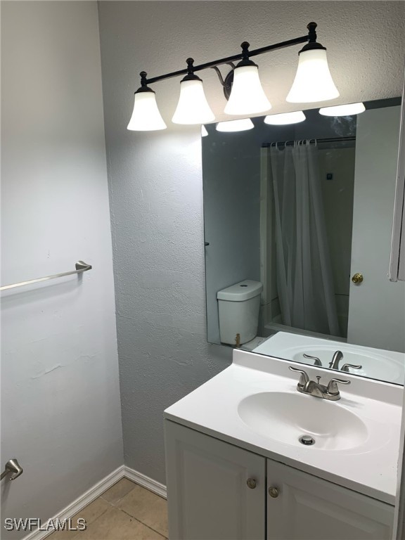 2929 Winkler Avenue, Unit 1018 Fort Myers, FL 33916 - Photo 23 of 34 a bathroom with a sink vanity and mirror