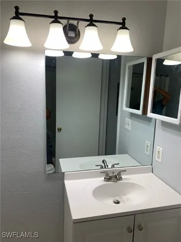 a bathroom with a shower and a bath tub