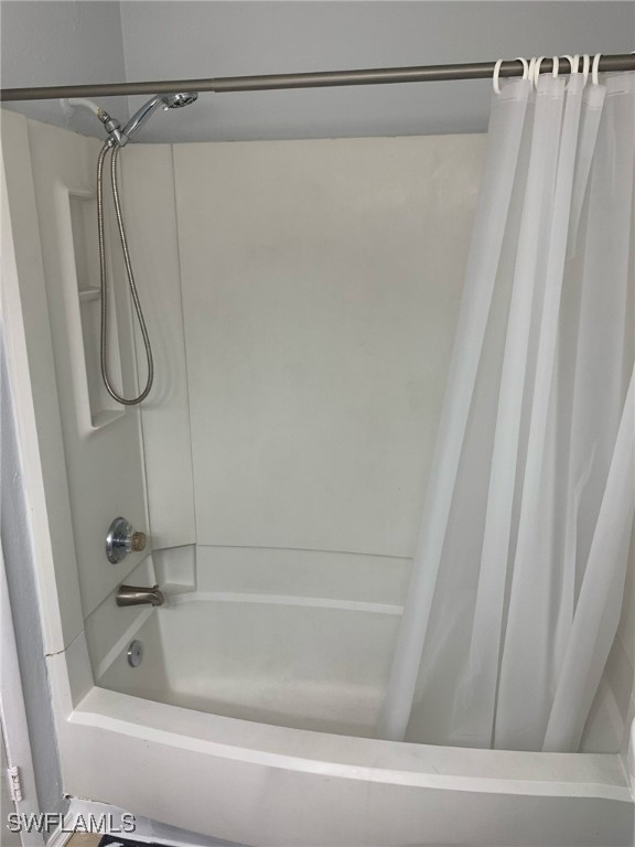 2929 Winkler Avenue, Unit 1018 Fort Myers, FL 33916 - Photo 25 of 34 a bathroom with a shower and a bath tub