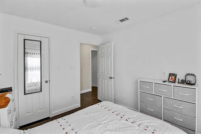 a bedroom with a bed and a closet